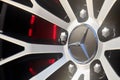 Mercedes-Benz AMG alloy wheel plug and rims selective focus closeup. German luxury expensive automobile part macro shot Royalty Free Stock Photo