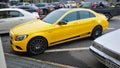 Mercedes Benz in Bright Yellow parked