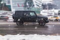 Mercedes Benz G Class W463 model on winter street in motion Royalty Free Stock Photo