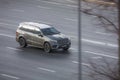 Mercedes-Benz GLS 400 4Matic car drives fast on road. Aerial front side view