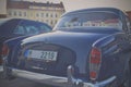 Mercedes Benz logo on a black vintage car. Mercedes-Benz is a German automobile producer. The brand is used for luxury automobiles Royalty Free Stock Photo