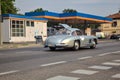 Mercedes Benz 300SL Gullwing on a road in an italian town at sunset