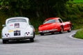 MERCEDES-BENZ 300 SL W 198 1955 PORSCHE 356 1600 COUPÃâ° 1956 on an old racing car in rally Mille Miglia 2020 the famous italian Royalty Free Stock Photo