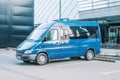 Mercedes-Benz Sprinter van parked in urban area. Blue passenger medium size commercial minibus, front side view Royalty Free Stock Photo