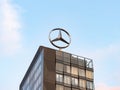 Mercedes Benz Star Emblem on a Rooftop