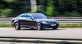 Luxury Mercedes-Benz s class speeding on empty highway Royalty Free Stock Photo