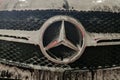 Mercedes car. Radiator grill with logo in foam at a car wash.