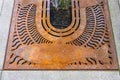 MERCER ISLAND, WA, USA Ã¢â¬â JANUARY 22, 2022: Downtown Mercer Island, sidewalk detail, iron grate with fish design