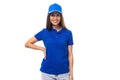 merch design concept. young woman in a blue t-shirt and cap on a white background with copy space