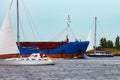 Blue cargo ship underway