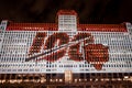 The Chicago Bears NFL is celebrating it's 100th playing season with wall art at night on the Merchandise Mart facade. Royalty Free Stock Photo