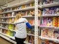 Merchandiser stands at the shelves with books