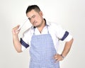 Merchant Asian man in white and blue apron is feeling regret or boring when get bad news from connection internet in tablet