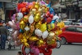 merchant selling colorful balloons in hanoi