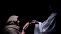 Mercy Jesus in crown of thorns giving bread for hungry homeless man, miracle Royalty Free Stock Photo