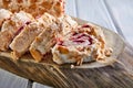Merengue pie with pistachios and jam on a wooden board Royalty Free Stock Photo