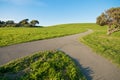 Merging Path on green landscape and blue sky Royalty Free Stock Photo