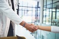 Merging to improve clinical care. Closeup shot of doctors shaking hands during a meeting in a hospital. Royalty Free Stock Photo