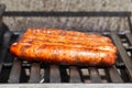 Merguez Sausage Grilling On A Gas Barbecue During A Beautiful Summer Day Royalty Free Stock Photo