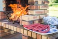 Merguez sausages on a plate, masonry barbecue Royalty Free Stock Photo