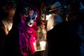 Close up of costumed women dressed as Catrinas with skull make-up holding candles at the event for dias de los muertos at the Fest Royalty Free Stock Photo