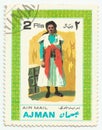 MERIDA, EXTREMADURA, SPAIN. DIC, 01, 2.108 - A stamp shows the typical clothes of peolpe of Ajman, city of Emirates Arab United .