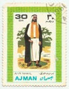 MERIDA, EXTREMADURA, SPAIN. DIC, 01, 2.108 - A stamp shows the typical clothes of peolpe of Ajman, city of Emirates Arab United .