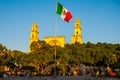 Merida San Ildefonso cathedral in the evening. Mexican flag flutters on air. Yucatan. Mexico