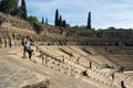 Tourists visiting the Roman ruins theatre arena & waiting rooms used for gladiator & animal fights in Merida, Spain