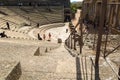 Tourists visiting the Roman ruins theatre arena & waiting rooms used for gladiator & animal fights in Merida, Spain