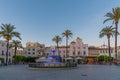 Merida, Spain, May 19, 2021: Sunset over town hall viewed throug