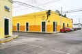 Merida / Yucatan, Mexico - June 1, 2015: The traffic corner with colorful yellow building in background in the city of Merdia, Yuc Royalty Free Stock Photo