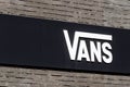 Merignac, France - June 5, 2017: Vans logo on a wall. Vans is an American manufacturer of shoes, based in Cypress Royalty Free Stock Photo