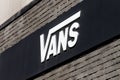 Merignac, France - June 5, 2017: Vans logo on a wall. Vans is an American manufacturer of shoes, based in Cypress Royalty Free Stock Photo