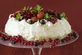 Meringue Cake Pavlova with cream, berries and mint