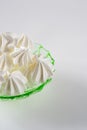 Meringue cookies on a green glass retro plate