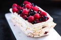 Meringue layers Pavlova with summer fruits