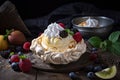 meringue nest, filled with custard cream and fruit