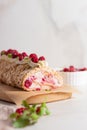 Meringue roll cake with berries whipped cream and Coffe. Summer dessert. Royalty Free Stock Photo