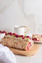 Meringue roll cake with berries whipped cream and Coffe. Summer dessert. Royalty Free Stock Photo