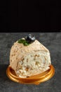 Meringue roll cake with cream on dark background. delicious dessert on the pastry shop menu. Royalty Free Stock Photo