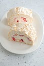 Meringue roll cake with cream, raspberries. Roulade, summer dessert. Confectionery, menu. Close up Royalty Free Stock Photo