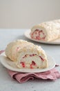 Meringue roll cake with cream, raspberries. Roulade, summer dessert. Confectionery, menu. Close up Royalty Free Stock Photo