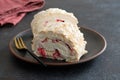 Meringue roll cake with cream, raspberries. Roulade, summer dessert. Confectionery, menu. Close up Royalty Free Stock Photo