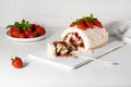 Meringue roll decorated with strawberries and mint leaves Royalty Free Stock Photo