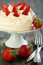 Meringue with whipped cream and strawberries.