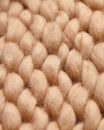 Merino wool handmade knitted large blanket, super chunky yarn, trendy concept. Close-up of knitted blanket, merino wool background Royalty Free Stock Photo