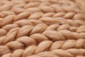 Merino wool handmade knitted large blanket, super chunky yarn, trendy concept. Close-up of knitted blanket, merino wool background Royalty Free Stock Photo