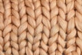 Merino wool handmade knitted large blanket, super chunky yarn, trendy concept. Close-up of knitted blanket, merino wool background Royalty Free Stock Photo