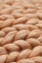 Merino wool handmade knitted large blanket, super chunky yarn, trendy concept. Close-up of knitted blanket, merino wool background Royalty Free Stock Photo